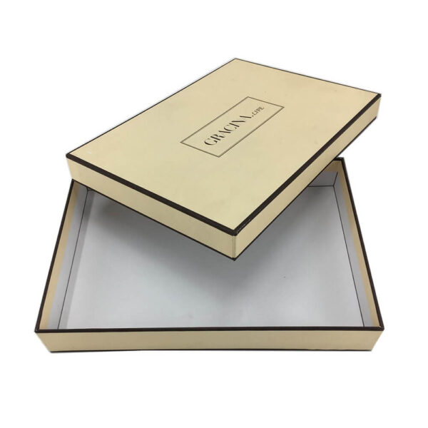 Open two-piece rigid box with a cream lid