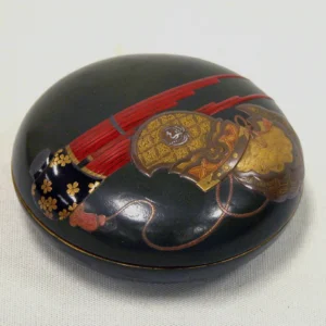 Round dark gift box with red stripe